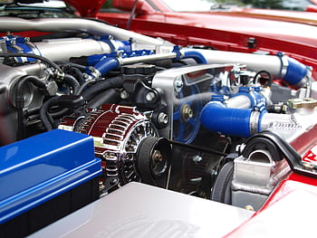 Blue Silver Black Car Engine, clean modern car engine, vibrant colored components, sleek design, car engine components, detailed engine view, automotive engine, car engine parts, engine design, engine components, car engine details