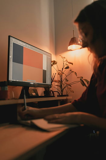 1. Creative Workspace  
2. Graphic Designer  
3. Home Studio  
4. Designer at Desk  
5. Warm-Lit Environment  
6. Cozy Studio  
7. Computer Graphics  
8. Digital Art  
9. Graphic Design Workspace