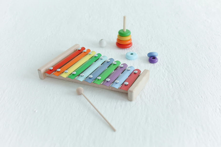al toys, xylophone, stacking toys, educational toys, fun themes, vibrant colors, white background, children's toys, wooden toys, rainbow colors, baby toys