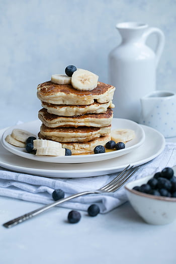 pancakes, banana, blueberries, ceramic plates, breakfast setting, yummy pancakes, stack of pancakes, banana pancakes, blueberry pancakes, breakfast food, serene breakfast