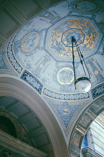 church interior, decorated ceiling, historic cathedral, ornate patterns, intricate architecture, single chandelier, ceiling design, religious architecture, interior design, chandelier lighting, cathedral ceiling