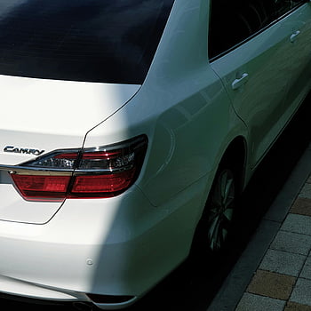 white car, Toyota Camry, parked car, curbside view, rear tail light, sunny street, white Toyota, car parking, street parking, vehicle exterior, car details