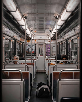 Paris Metro, train car, passengers commuting, interior view, symmetry, public transportation, urban travel, subway train, seated passengers, travel photography, city transit