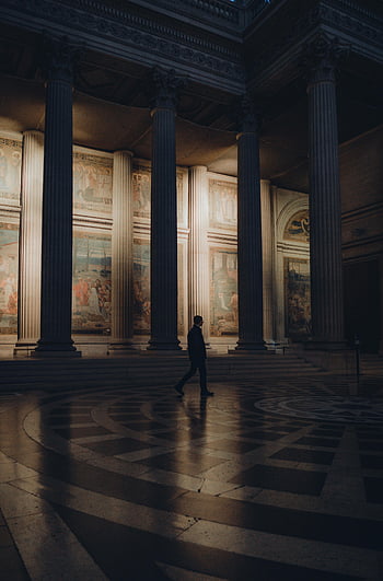 museum hall, darkness, silhouette, elegant hall, tall columns, classical paintings, interior architecture, historical building, art gallery, dim lighting, architectural design