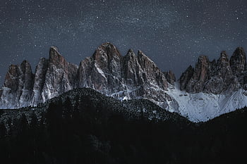 stars on sky, snowy mountain peaks, star-filled night sky, nature's beauty, dramatic mountains, night landscape, winter scenery, mountain range, starry night, outdoor photography, natural beauty