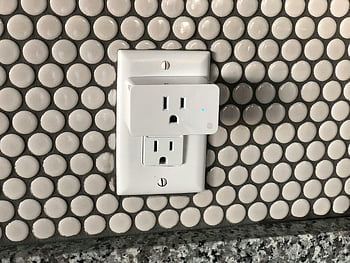smart plug, electric socket, tiled wall, contemporary interior, close-up, smart home, wall outlet, modern design, smart device, home automation, smart technology