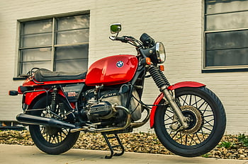 red and black motorcycle, vintage BMW motorcycle, parked beside building, brick background, pavement, red motorcycle, black motorcycle, vintage motorcycle, BMW motorcycle, red and black, motorcycle parked