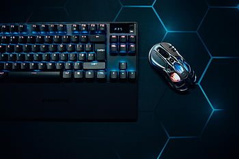 RGBゲームキーボード、 RGBゲーミングマウス、 六角形パターン、 鮮やかな照明、 技術愛好家、 スタイリッシュなキーボード、 ゲームアクセサリー、 ゲーム設定、 キーボードとマウスの組み合わせ、 ゲーム周辺機器、 技術ガジェット