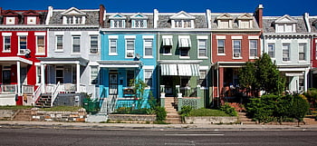 row houses, vibrant architecture, sunny street, urban charm, colorful buildings, cityscape, residential area, outdoor scene, neighborhood, day time, architecture design