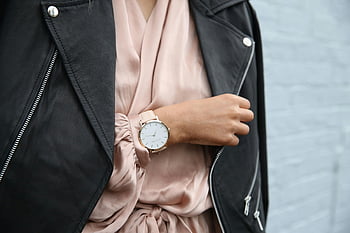 peach dress, black jacket, left hand, closeup photography, stylish woman, leather jacket, elegant wristwatch, fashion-forward, individual, wristwatch, outfit
