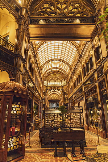 Budapest landmark, classic styled hall, arched passage, historic interior, intricate designs, luxurious interior, old building, ornate ceiling, vintage architecture, decorative details, grand hall