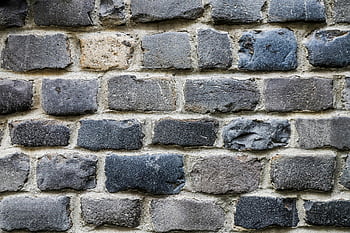 brick wall, textured stone, rough surface, solid patterns, detailed view, stone bricks, wall texture, brick patterns, stone wall, wall surface, textured bricks