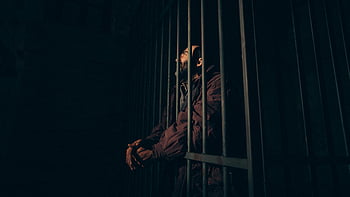 prisoner, behind bars, dark prison cell, confinement, solitude, man in prison, jail cell, incarcerated, prison life, solitary confinement
