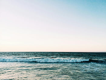 blue waves, sea, tranquil ocean, gentle waves, pastel sky, peace, relaxation, ocean scene, calm water, serene beach, coastal view