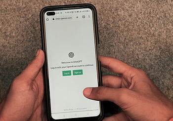 ChatGPT, OpenAI, AI chatbot, smartphone, ChatGPT app, hands using smartphone, login screen, capabilities, limitations, examples, prototype AI