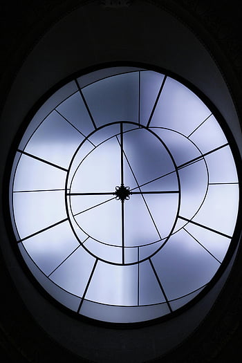 worm's eye view, glass ceiling, futuristic skylight, circular skylight, geometric design, light patterns, architectural feature, interior design, modern architecture, ceiling design, skylight design