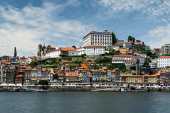 Porto Portugal, historic architecture, riverside charm, waterfront buildings, picturesque view, Douro River, colorful houses, European cityscape, old town, city skyline, travel destination