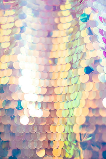 white and purple sequins, close-up shot, vibrant colors, reflective sequins, colorful sequins, bright backdrop, festive background, iridescent sequins, shiny texture, macro photography, festive sequins
