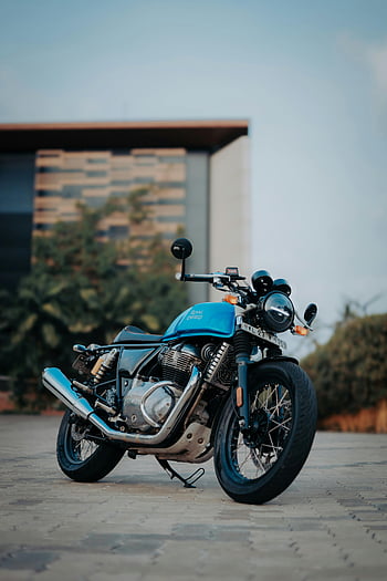 Royal Enfield, Continental GT, motorcycle, parked, sidewalk, blue, stylish, city environment, outdoor, motorbike, urban