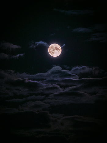full moon, night sky, dark clouds, serene atmosphere, mystical scene, moonlight, celestial view, night photography, lunar glow, cloudy night, moonlit sky