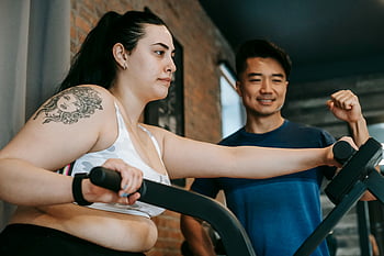 gym, young woman, personal trainer, elliptical, workout, training, fitness, exercise, indoor, health, guidance