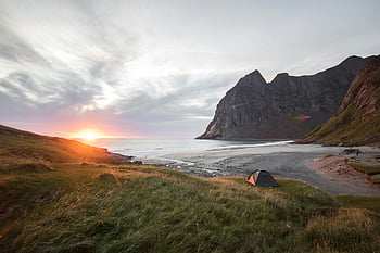 beach camping, sunrise view, majestic mountains, tent by beach, tranquil camping, sea camping, stunning sunrise, beach tent, camping by sea, seaside camping, mountain view camping