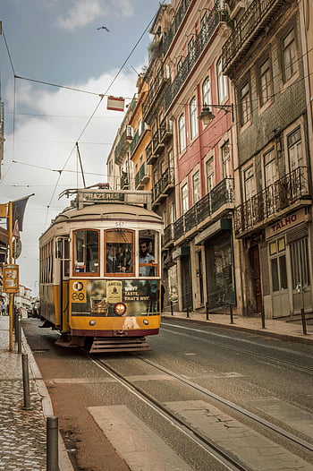 yellow tram, tramway, Lisbon, Portugal, vintage tram, picturesque streets, buildings, urban scene, public transportation, cityscape, travel destination
