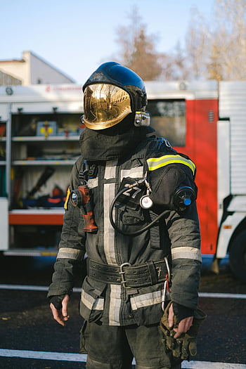 firefighter, uniform, protective gear, standing, fire truck, daylight, emergency services, fireman, safety equipment, rescue worker, fire department