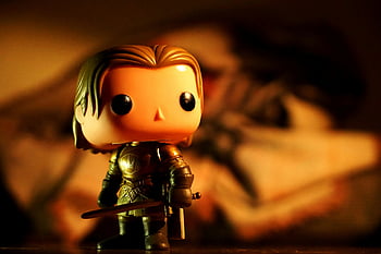 Warrior Bobblehead, cute toy figure, armor, dramatic light, warm tones, creative projects, bobblehead, toy, armor figure, dramatic lighting, warm colors