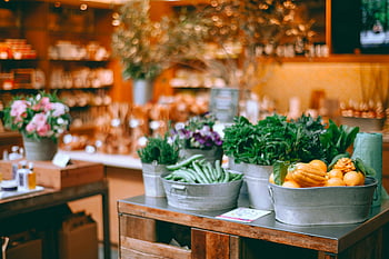 fresh vegetables, local shop, metal containers, cozy indoor market, vibrant vegetables, indoor market setting, fresh produce, market vegetables, local market, fresh greens, market display