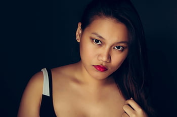 woman selfie, bold red lips, stunning portrait, elegance, glamour, dark background, confident pose, stylish look, beauty photography, female beauty, elegant woman