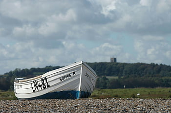 white and blue jon boat, seashore, Sophie B, pebble beach, cloudy sky, fishing boat, calm, solitude, landscape, outdoor, nature