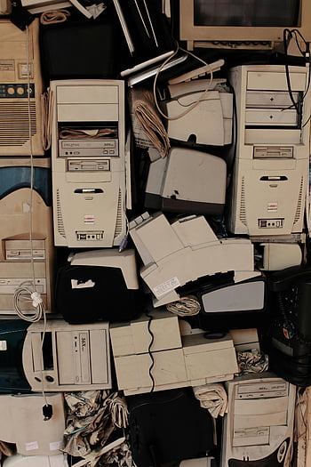 junk old computers, vintage computer components, stacked technology, retro electronics, obsolete tech, computer hardware, old monitors, outdated devices, electronic waste, computer relics, tech nostalgia