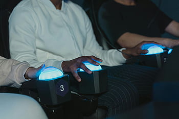 virtual reality, simulator, gamers, illuminated buttons, modern arcade, close-up, interactive gaming, virtual experience, arcade setting, gaming technology, immersive experience
