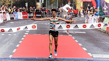 marathon-winner-finish-line-athletic-success-running-black-asphalt-road-triumphant-sports-event-race-completion-competition-celebration-thumbnail.jpg