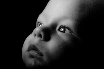 grayscale photography, baby face, black and white, portrait, studio lighting, infant, close-up, monochrome, child, eyes, expression