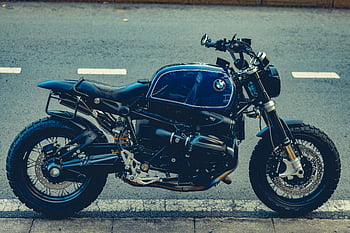 BMW motorcycle, roadside, city road, luxury design, engineering, stylish motorcycle, parked, urban setting, high-end bike, modern design, street scene