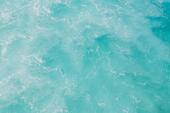 turquoise water, ocean waves, natural patterns, soothing view, close-up shot, artistic patterns, ocean surface, turquoise ocean, water texture, wave patterns, ocean artistry