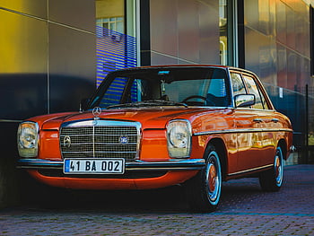 vintage Mercedes Benz, orange paint, classic luxury, vintage car, Mercedes Benz sedan, modern building background, stunning vintage, orange Mercedes Benz, classic car, luxury car, parked car