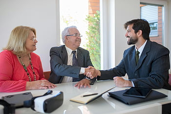 business professionals, shaking hands, office meeting, successful deal-making, men shaking hands, sitting at table, business deal, professional handshake, office environment, business people, business agreement