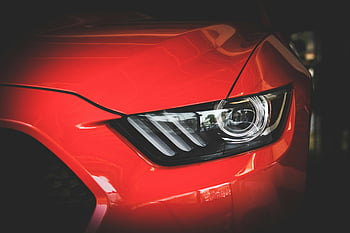 red car, headlight, Ford Mustang, sleek design, automotive design, detailed view, car headlight, red Mustang, car lighting, modern car, car details