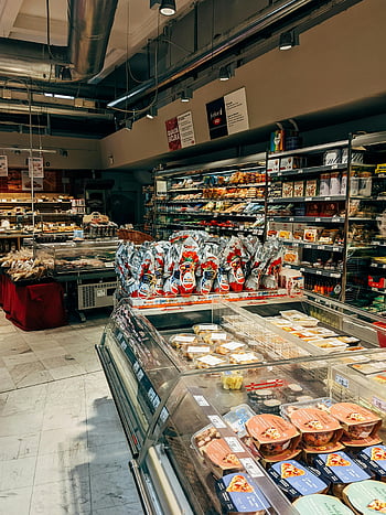 supermarket aisle, grocery products, food items, well-organized, diverse products, supermarket display, refrigerated section, packaged food, supermarket interior, aisle shelves, grocery store