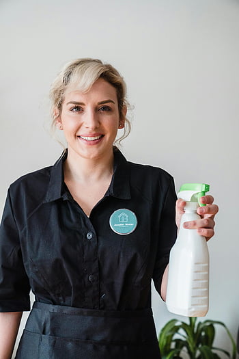 smiling woman, spray bottle, professional cleaning, indoor cleaning, uniform, cleaning services, house cleaning, professional cleaner, cleaning products, indoor services, cleaning staff