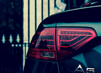 Audi A5, taillight, luxury automotive design, close-up, elegant, car tail light, Audi, A5, vehicle lighting, car design, automotive