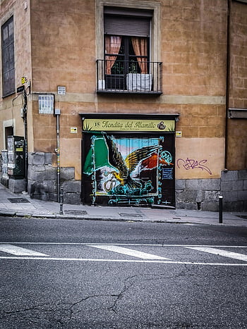 Mendital Del Alamillo, store facade, graffiti eagle, storefront Madrid, historic district, street art, urban art, eagle mural, cityscape, street photography, Madrid Spain