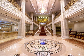 marble foyer, luxurious hotel, grand staircase, marble floors, dazzling chandelier, elegant hotel, hotel interior, ornate decor, reception area, chandelier lighting, luxury design