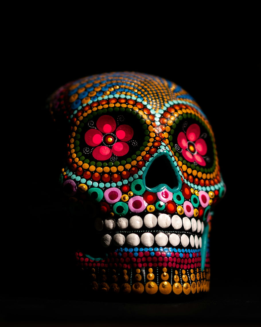 Multicolored Skull Decor, Day of the Dead, sugar skull, vibrant colors, intricate designs, black background, colorful skull, Mexican art, decorative skull, festive skull, skull art