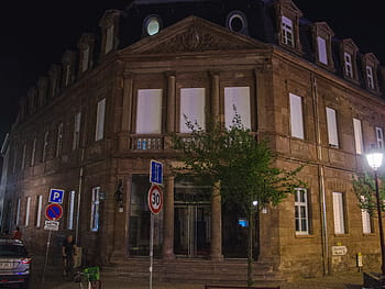 Ancien hôtel de ville, neo-classical architecture, pink sandstone, Doric columns, fluted Ionic columns, triangular pediments, dormer windows, night scene, street view, former town hall, Schiltigheim