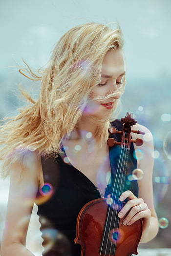 young female violinist, street performance, soap bubbles, outdoor music, serene harmony, closed eyes, blonde hair, violinist portrait, artistic expression, musical talent, street musician
