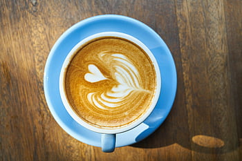 blue ceramic coffee mug, saucer, cappuccino, heart-shaped latte art, blue cup, wooden table, close-up, coffee drink, latte art, coffee mug